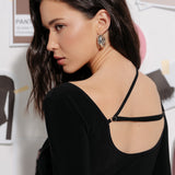 Bodysuit with a V-neckline and a decorative strap in Black