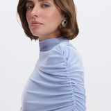 Draped cape with a stand-up collar in Light blue