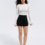 Top with rhinestones and feathers in Milk