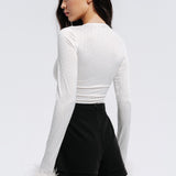 Top with rhinestones and feathers in Milk