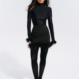 Top with a neckline and feathers in Black