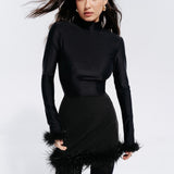 Top with a neckline and feathers in Black
