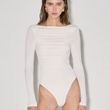 Bodysuit with draping and a turtleneck collar in Milk